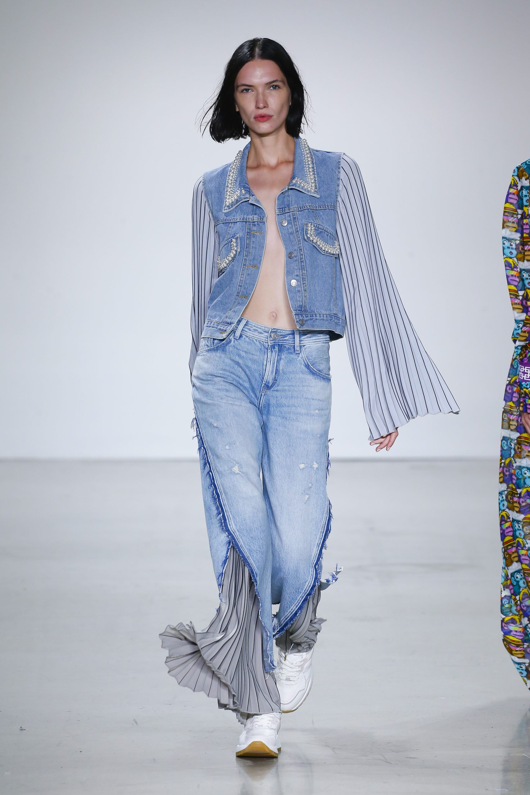 Female model with denim outfit at Metaverse, Past, Present, and Future SS23 show at New York Fashion Week