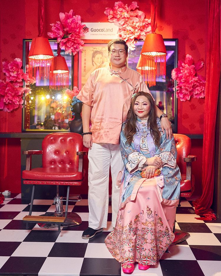 Guests pose with the GuocoLand Hair Salon backdrop at PINCNY2023 event