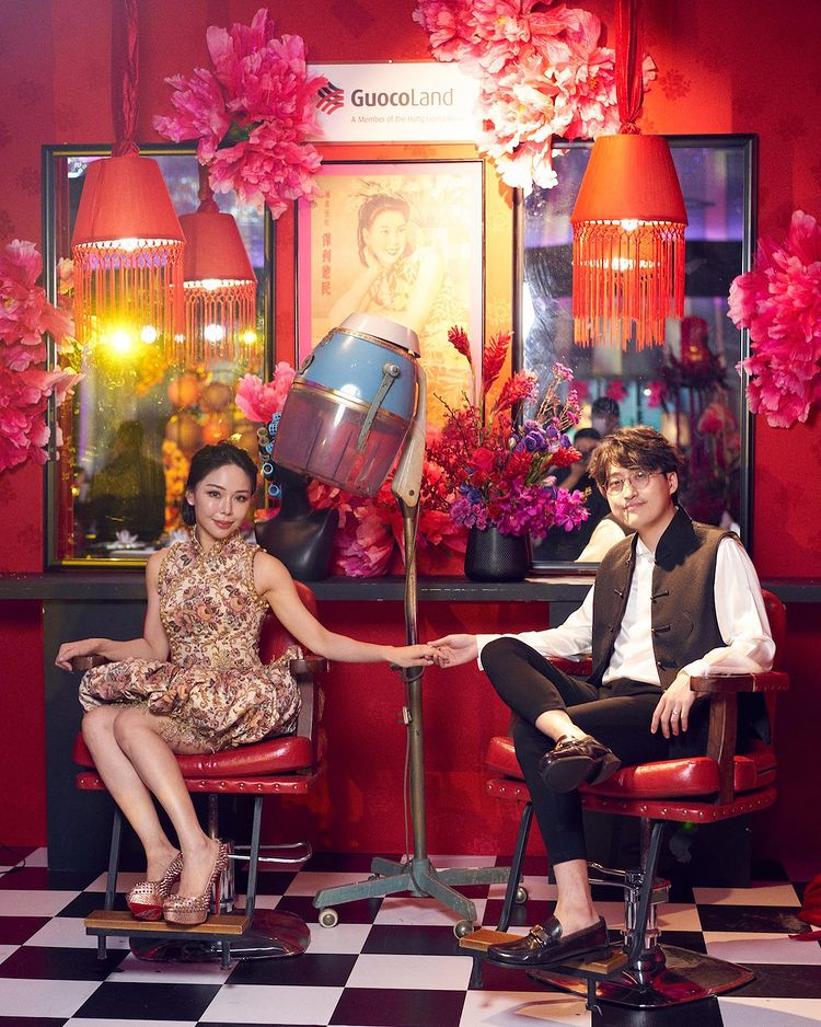 Guests pose with the GuocoLand Hair Salon backdrop at PINCNY2023 event